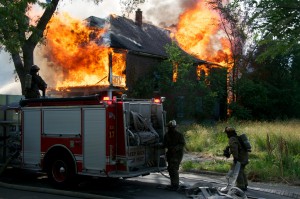 firemen fight a house fire