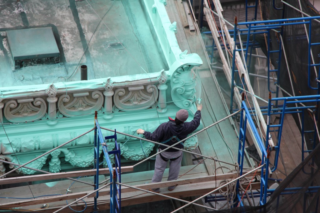 roof-hazards-3 construction worker spray painting on roof
